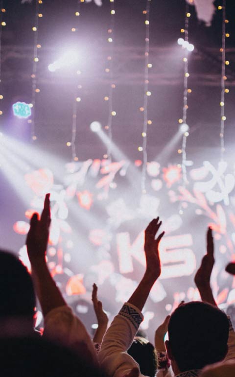 Late-night afterparty with club lighting and guests dancing in Charleston.