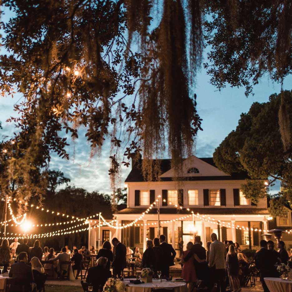 Charleston café-style wedding reception with string lights and intimate ambiance