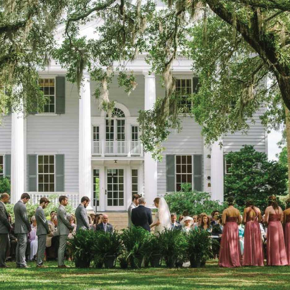 Charleston plantation estate lawn ceremony setup for a southern wedding