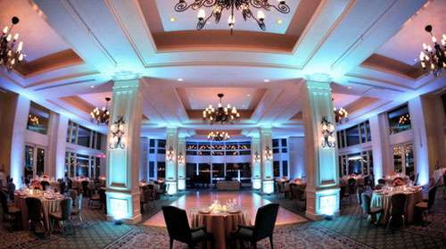 Cool-toned blue uplighting in an event venue.